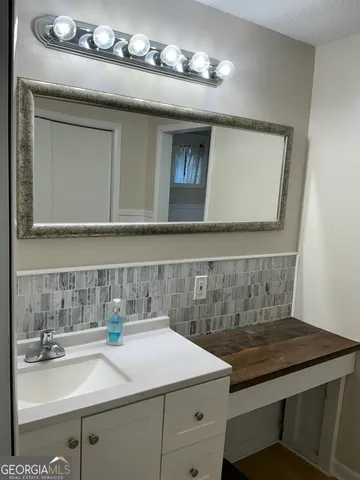 a kitchen with stainless steel appliances a refrigerator and a sink
