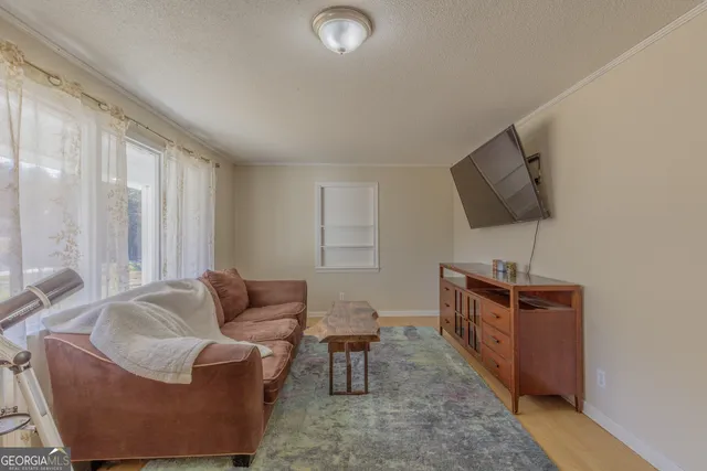 a bathroom with a shower curtain and a window