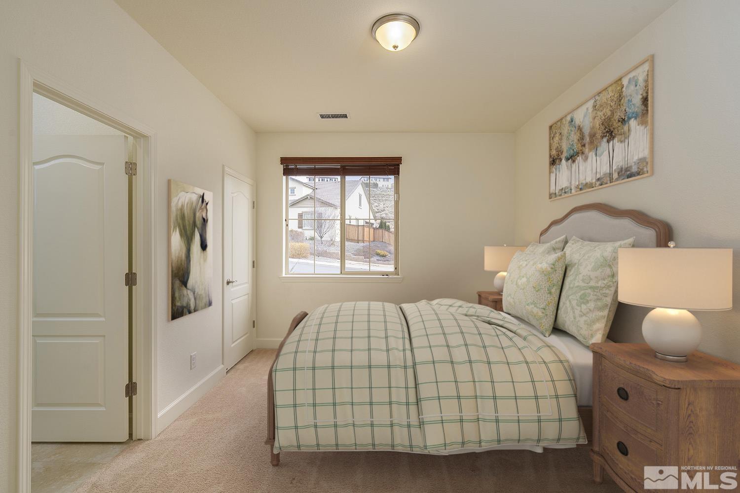1675 Scott Valley Road Reno, NV 89523 - Photo 20 of 40 a bedroom with a bed and painting on the wall