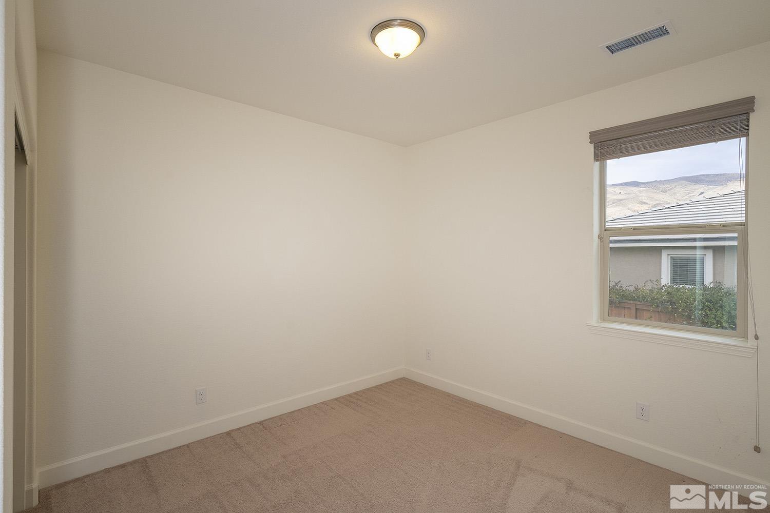 1675 Scott Valley Road Reno, NV 89523 - Photo 27 of 40 an empty room with a window