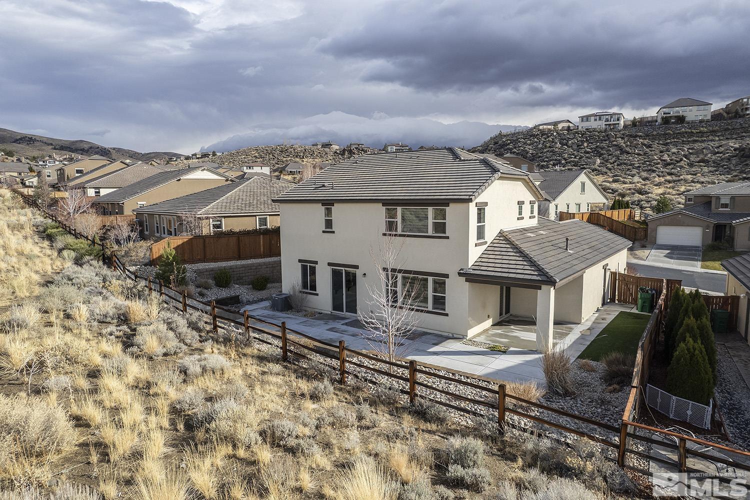 1675 Scott Valley Road Reno, NV 89523 - Photo 4 of 40 a view of a large buildings with wooden fence