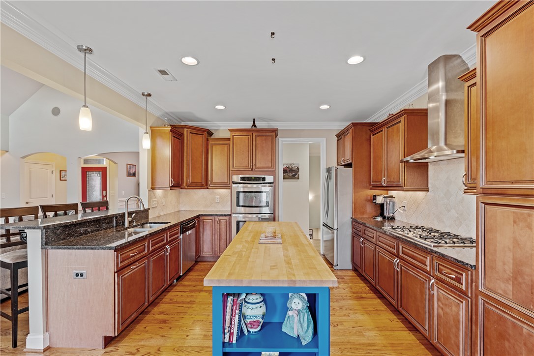 119 Turnberry Road Anderson, SC 29621 - Photo 14 of 50 This kitchen showcases ample cabinet space, a central island, and modern stainless steel appliances.