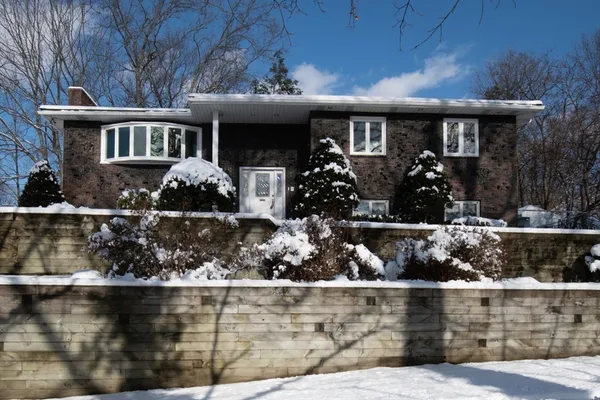 a front view of house with outdoor seating