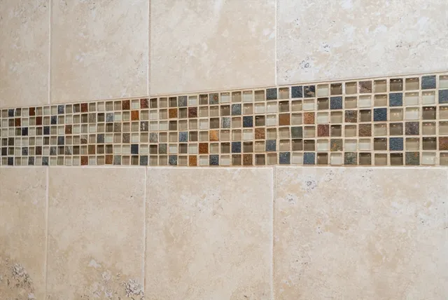 a living room with furniture a flat screen tv and a large window