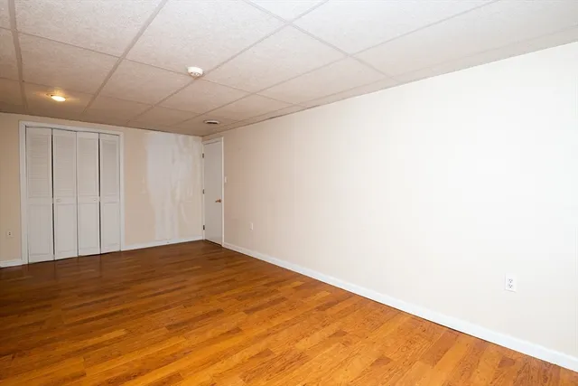 a view of a patio with a table and chairs under an umbrella