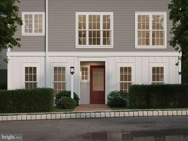 front view of a brick house with a street