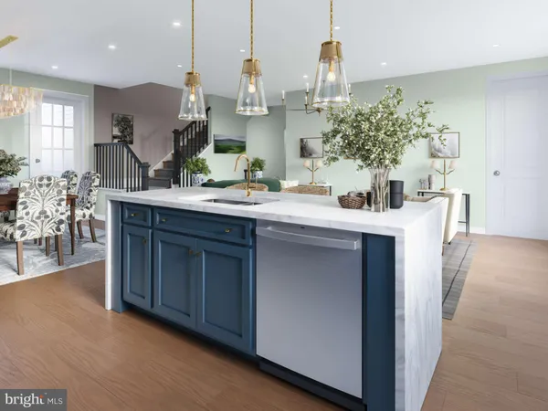 a kitchen with stainless steel appliances kitchen island granite countertop a sink a stove and a wooden floors