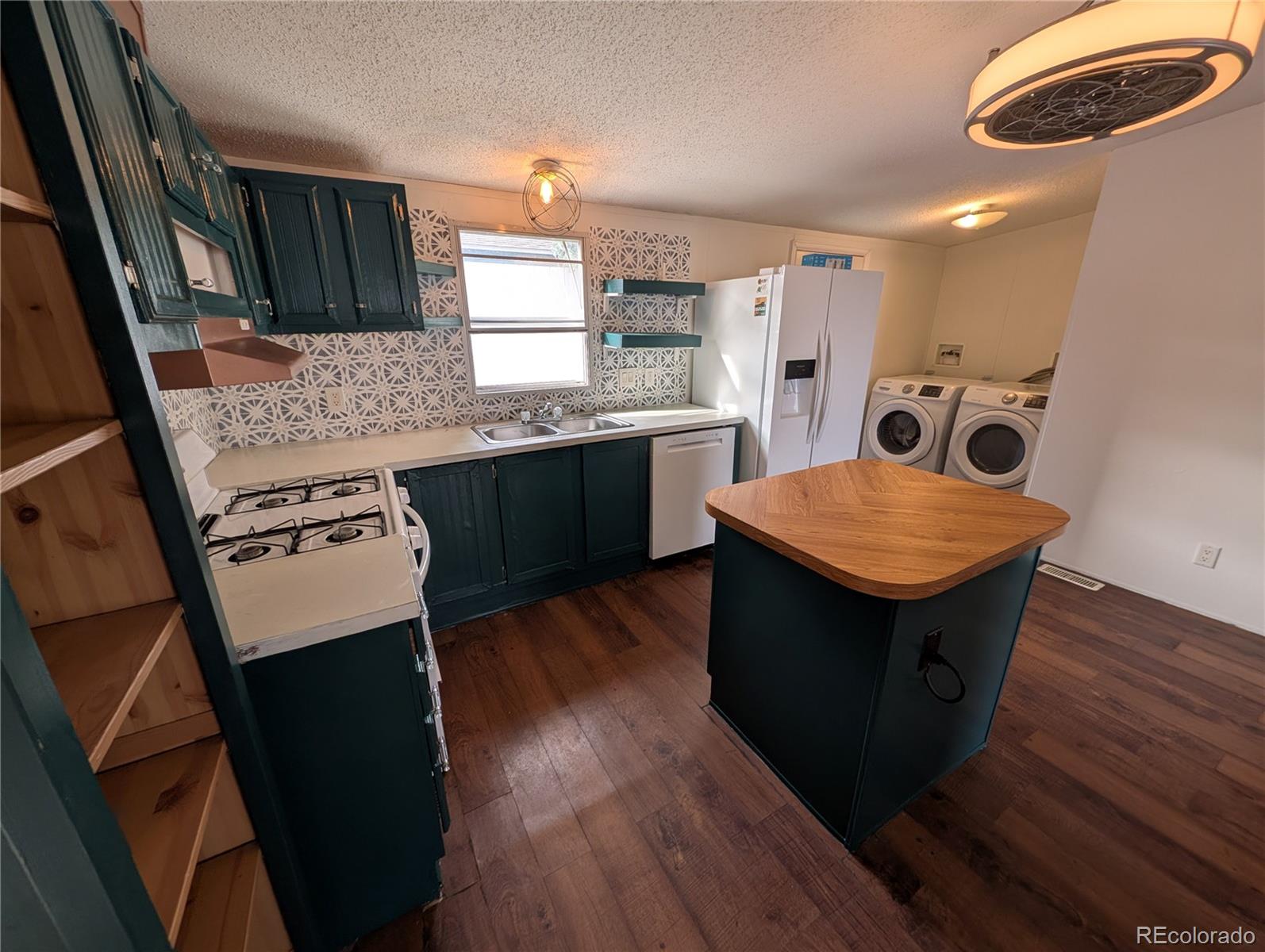 17190 Mt Vernon Road Golden, CO 80401 - Photo 1 of 29 a kitchen with stainless steel appliances granite countertop a stove and a refrigerator