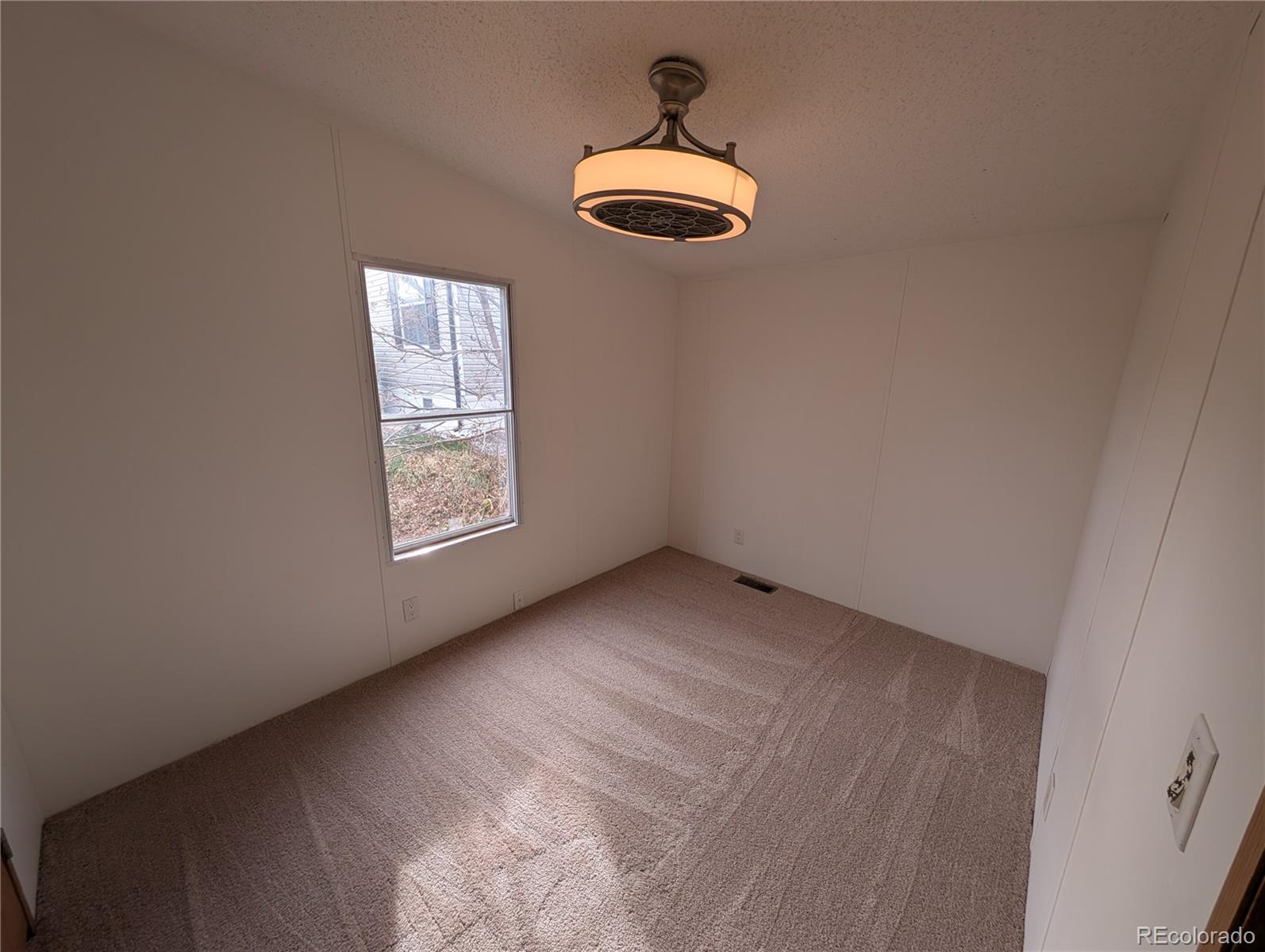 17190 Mt Vernon Road Golden, CO 80401 - Photo 17 of 29 a view of an empty room with a window
