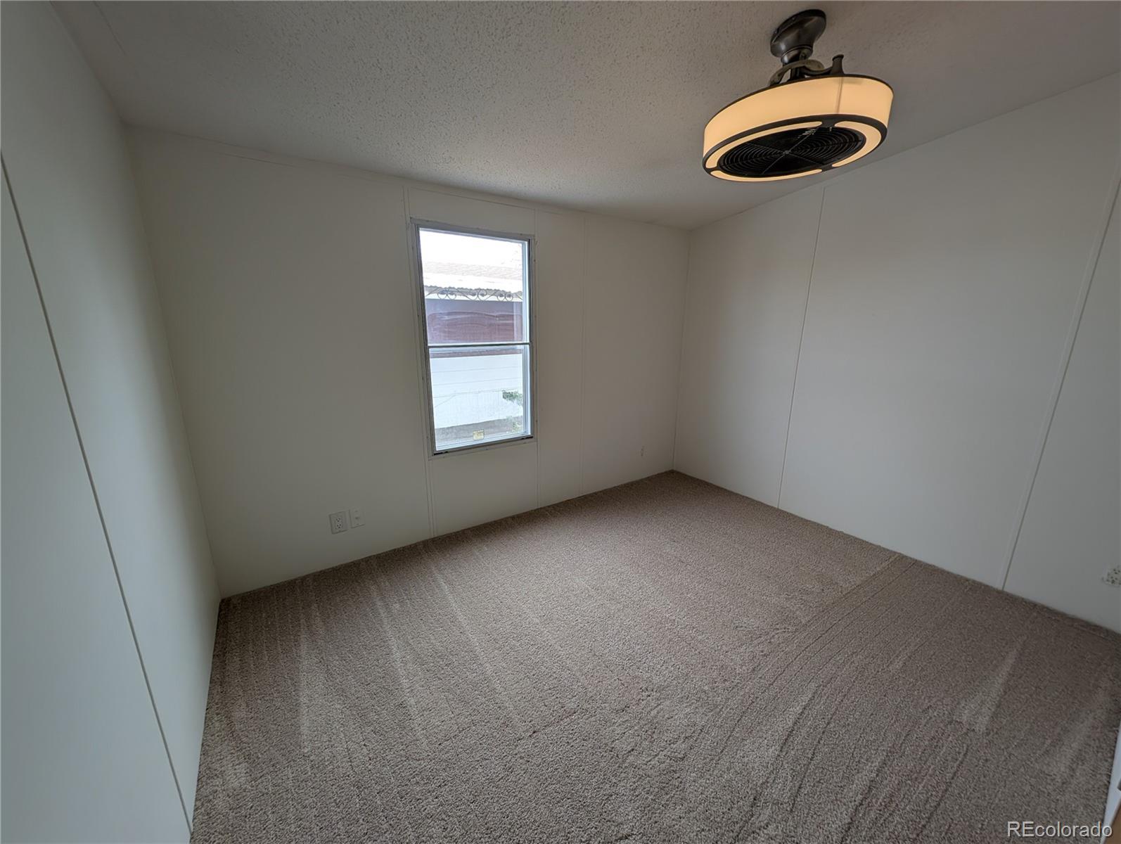 17190 Mt Vernon Road Golden, CO 80401 - Photo 19 of 29 a view of an empty room with a window