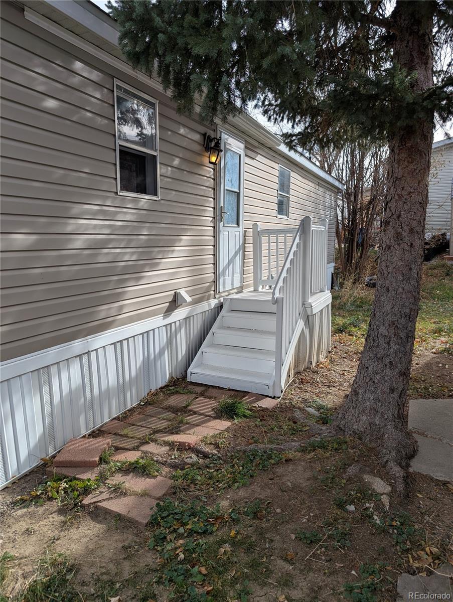 17190 Mt Vernon Road Golden, CO 80401 - Photo 2 of 29 a view of a house with a yard