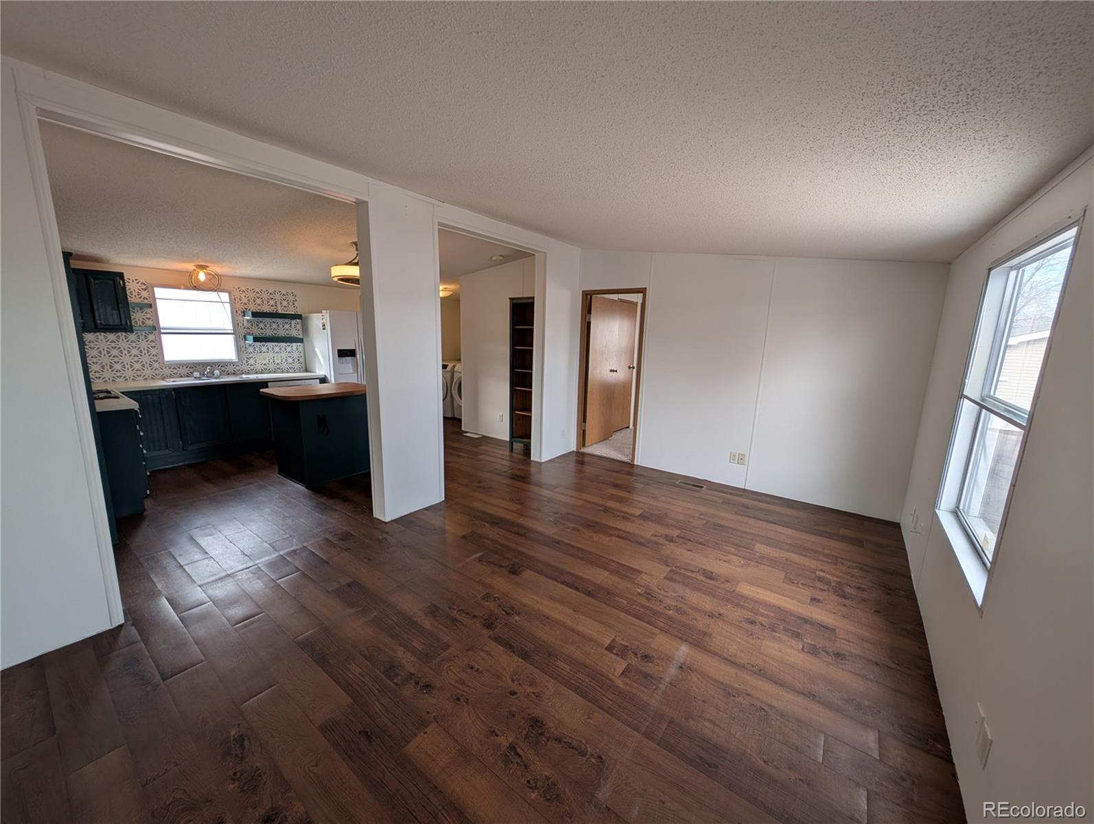 17190 Mt Vernon Road Golden, CO 80401 - Photo 21 of 29 wooden floor in an empty room with a window