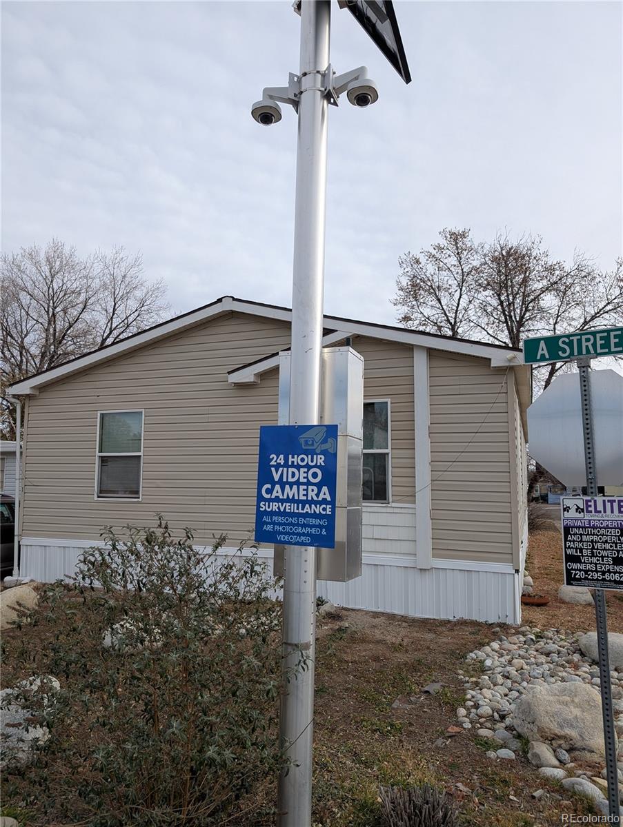 17190 Mt Vernon Road Golden, CO 80401 - Photo 27 of 29 a sign on the side of a house