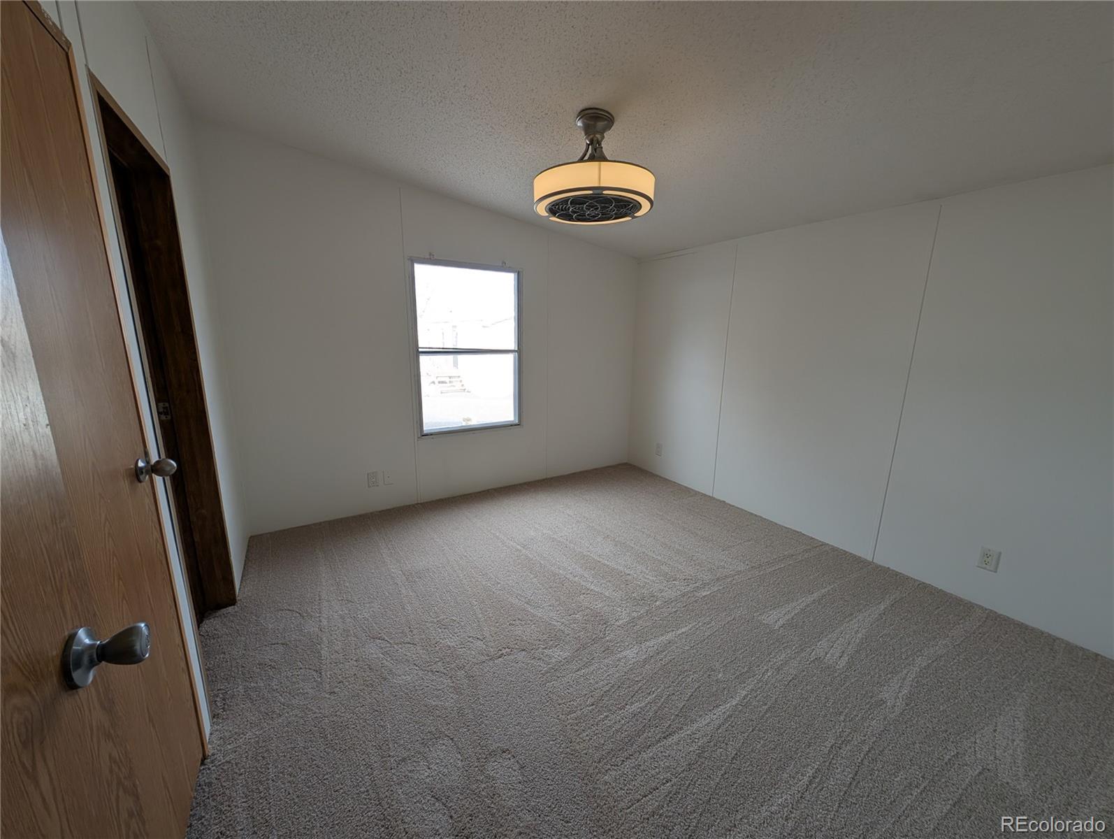 17190 Mt Vernon Road Golden, CO 80401 - Photo 9 of 29 an empty room with windows