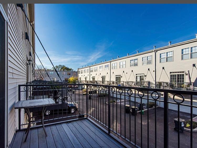 7426 West Fullerton Avenue Elmwood Park, IL 60707 - Photo 11 of 20 a view of balcony with wooden floor and outdoor seating