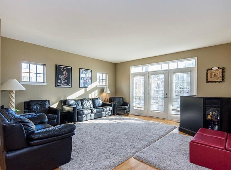 7426 West Fullerton Avenue Elmwood Park, IL 60707 - Photo 12 of 20 a living room with furniture large window and a flat screen tv