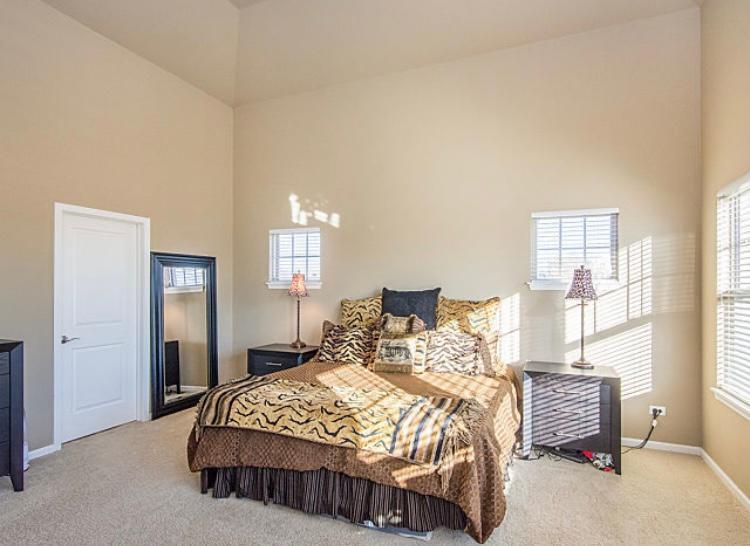 7426 West Fullerton Avenue Elmwood Park, IL 60707 - Photo 16 of 20 a bedroom with a bed and window
