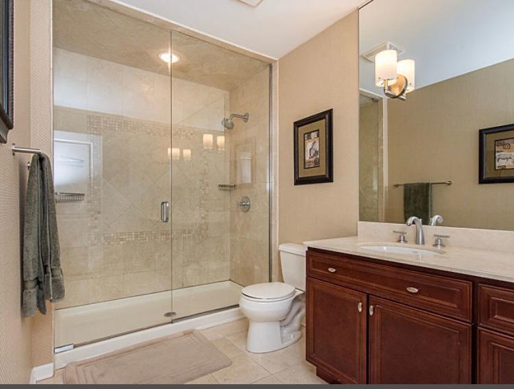 7426 West Fullerton Avenue Elmwood Park, IL 60707 - Photo 18 of 20 a bathroom with a sink a toilet and shower