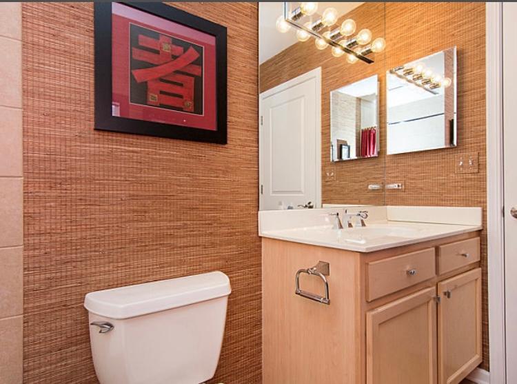 7426 West Fullerton Avenue Elmwood Park, IL 60707 - Photo 19 of 20 a bathroom with a toilet a sink and mirror