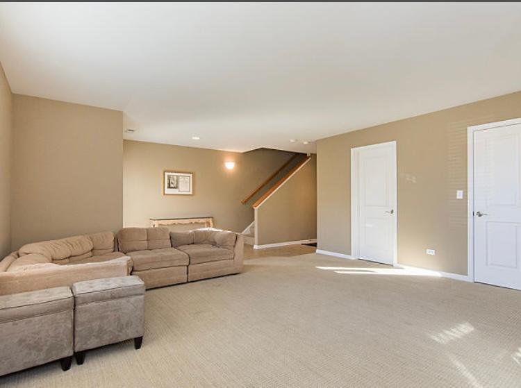 7426 West Fullerton Avenue Elmwood Park, IL 60707 - Photo 3 of 20 a living room with furniture and a ceiling fan
