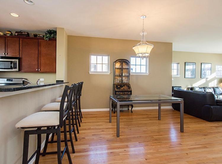 7426 West Fullerton Avenue Elmwood Park, IL 60707 - Photo 7 of 20 a living room with furniture dining table and a window