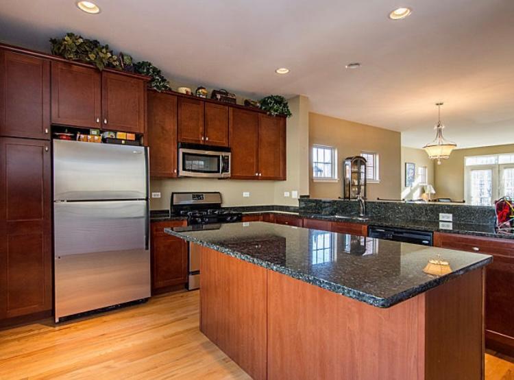 7426 West Fullerton Avenue Elmwood Park, IL 60707 - Photo 9 of 20 a kitchen with granite countertop a stove sink and refrigerator