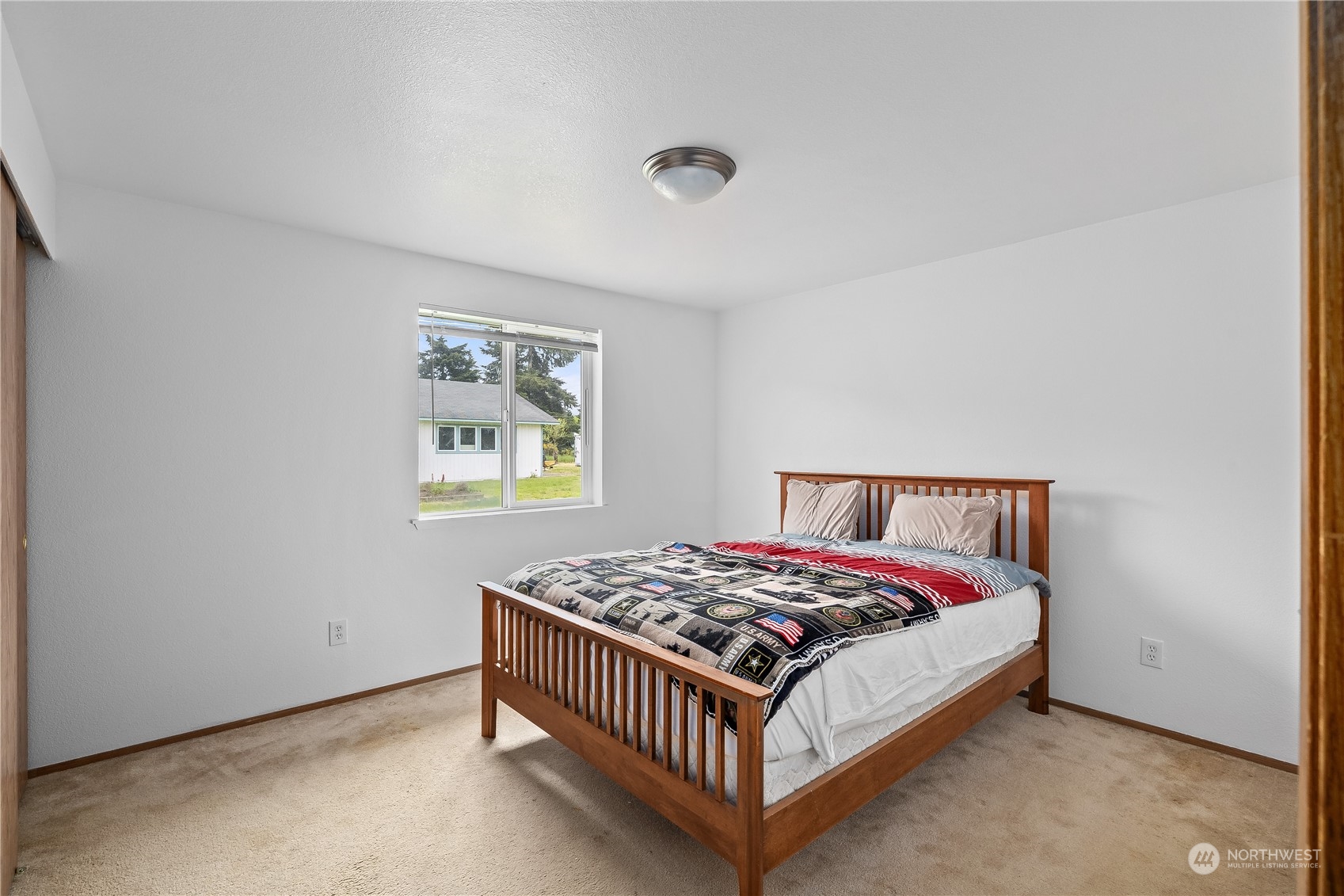 10532 School Land Road Southwest Rochester, WA 98579 - Photo 19 of 23 a bedroom with a bed and a window