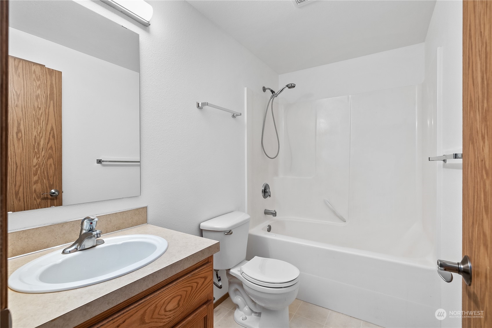 10532 School Land Road Southwest Rochester, WA 98579 - Photo 20 of 23 a bathroom with a sink toilet tub and shower