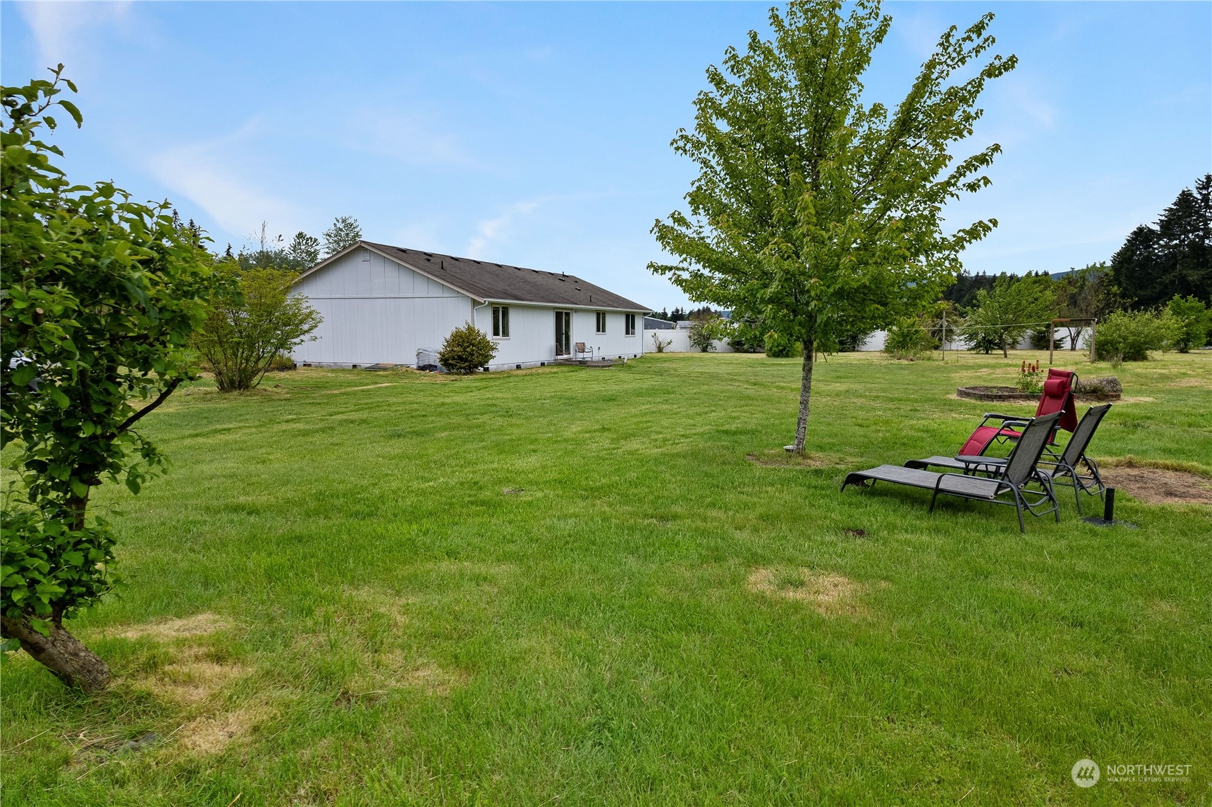 10532 School Land Road Southwest Rochester, WA 98579 - Photo 4 of 23 a view of a house with a yard porch and sitting area