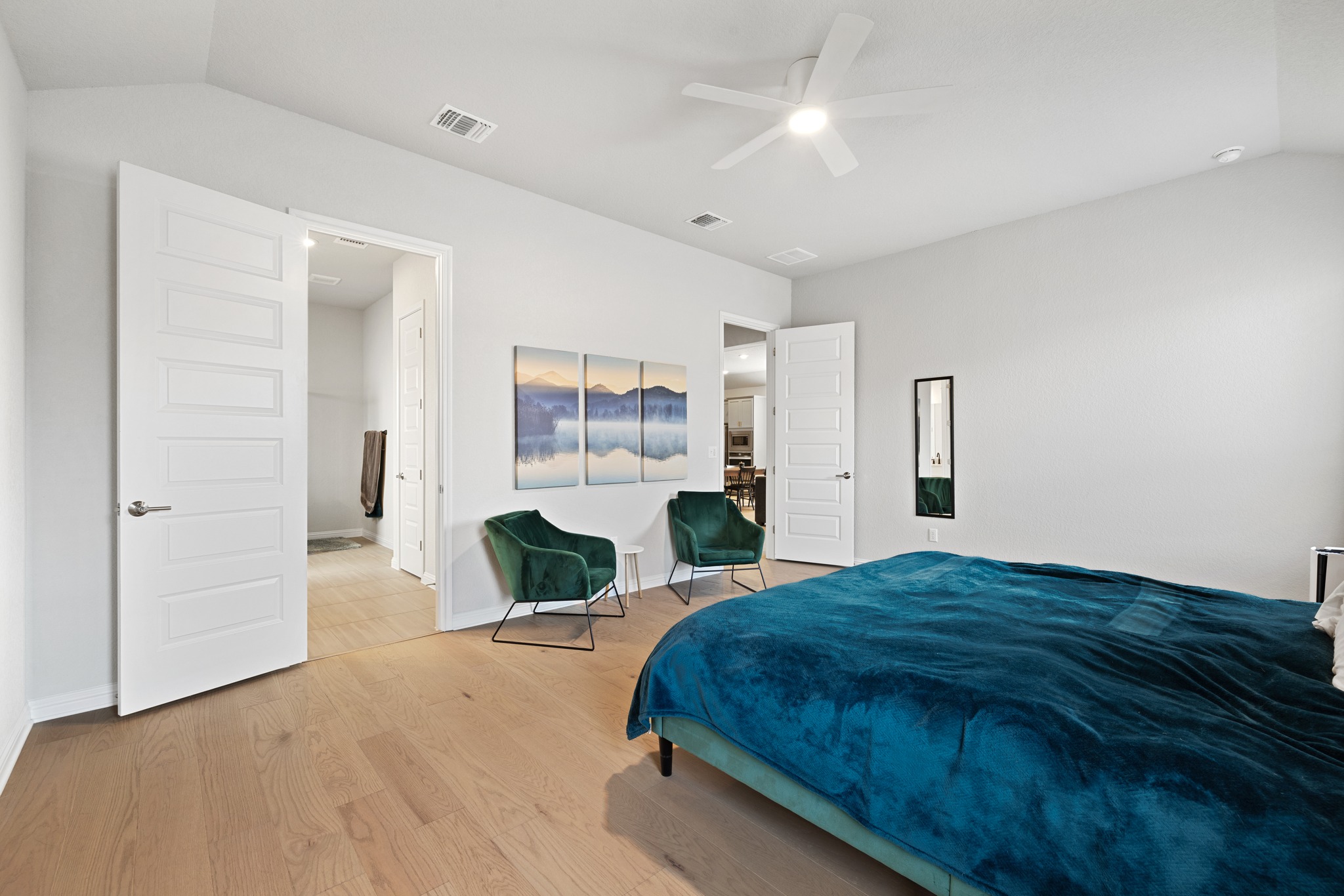 8405 Hubble Walk Austin, TX 78744 - Photo 15 of 36 Bedroom featuring vaulted ceiling, light wood-style flooring, and ceiling fan