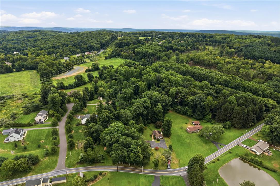 3573 Lower Saucon Road Hellertown, PA 18055 - Photo 51 of 56 An aerial perspective showcases a lush landscape of rolling hills and dense woodlands.