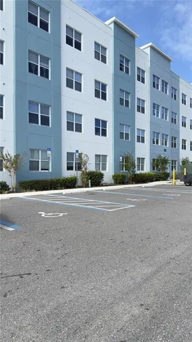 a view of street with a building in front of it