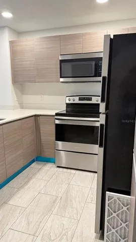 a kitchen with a stove and a microwave