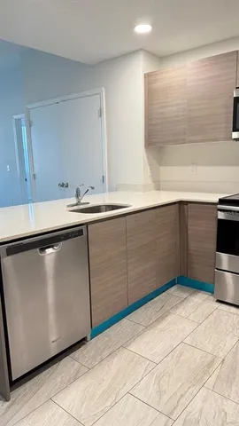 a kitchen with a sink and cabinets