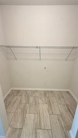 a view of an empty walk in closet