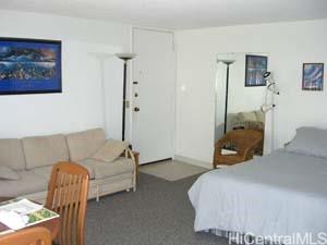 2572 Lemon Road, Unit 1104 Honolulu, HI 96815 - Photo 2 of 7 a bedroom with a bed and a couch