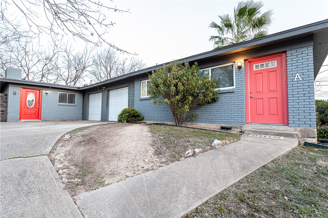 1602 Parker Lane, Unit B Austin, TX 78741 - Photo 1 of 1 a front view of house with garage