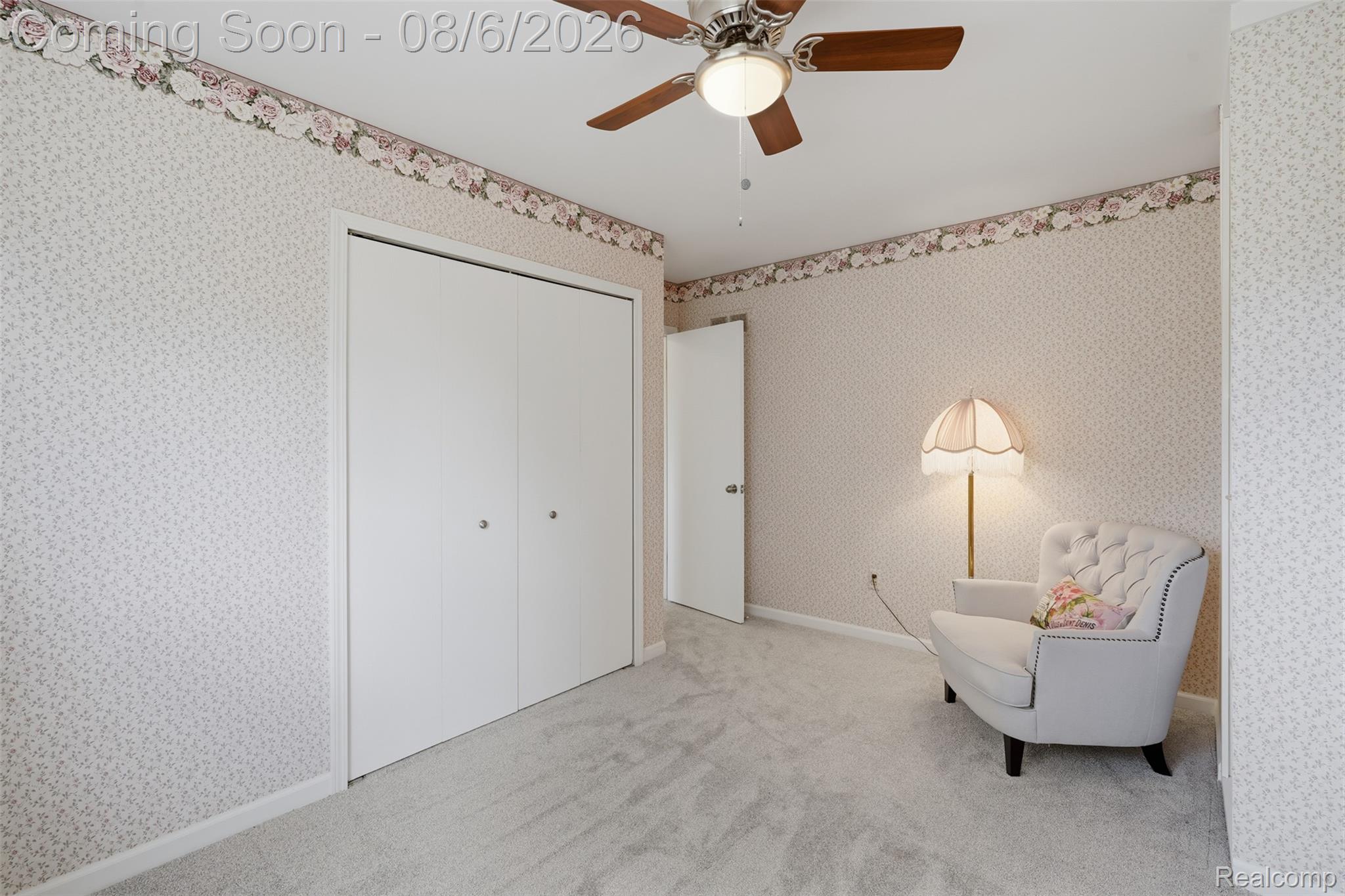3585 Loon Lake Road Wixom, MI 48393 - Photo 21 of 40 Spacious room featuring light-toned patterned wallpaper, a bi-fold closet, and plush carpet flooring