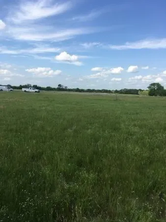 a view of an ocean and yard