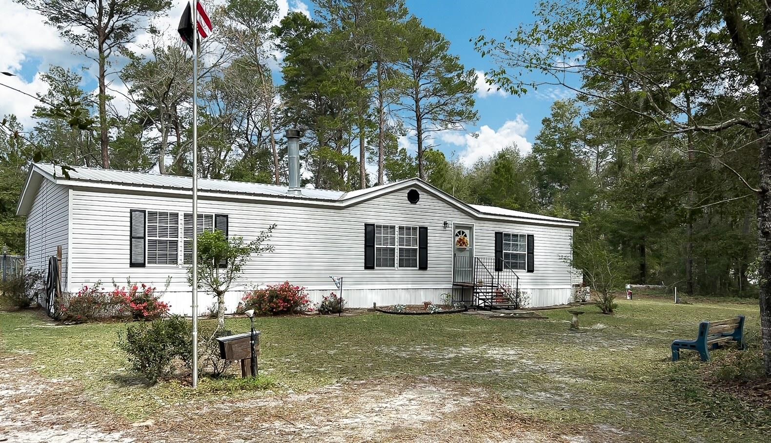 100 Harper Place Satsuma, FL 32189 - Photo 1 of 32 a view of outdoor space yard and deck