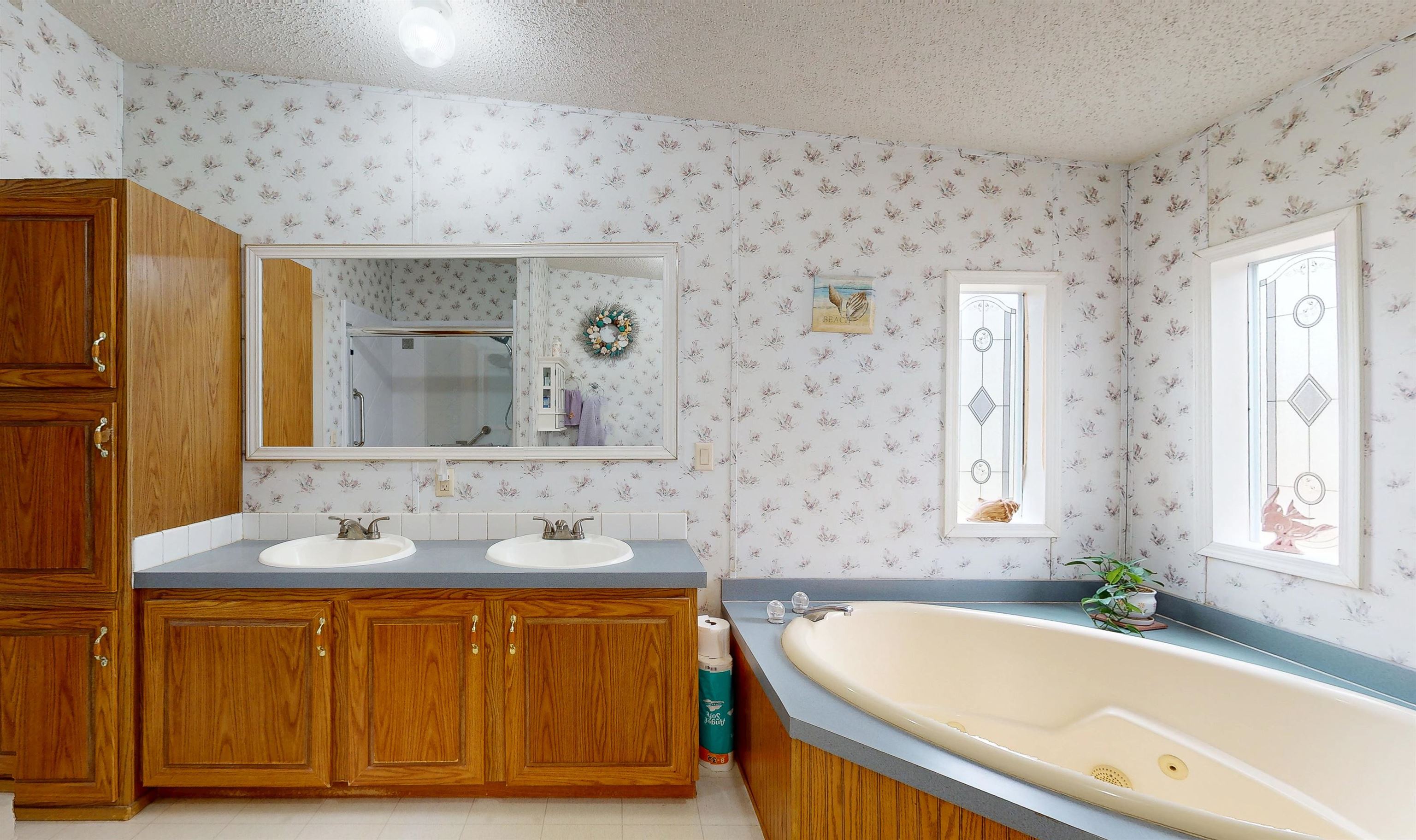 100 Harper Place Satsuma, FL 32189 - Photo 11 of 32 a bathroom with a tub sink and mirror