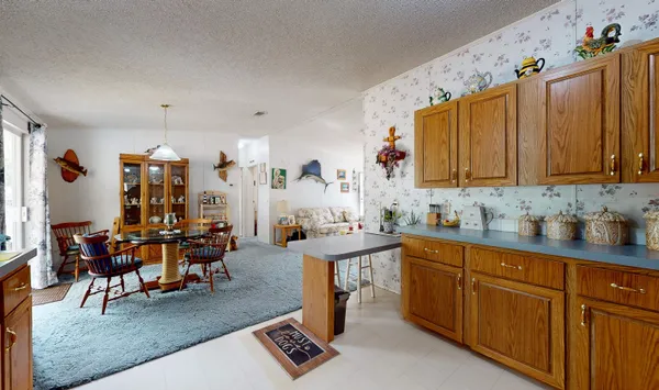 a view of a kitchen and dining room