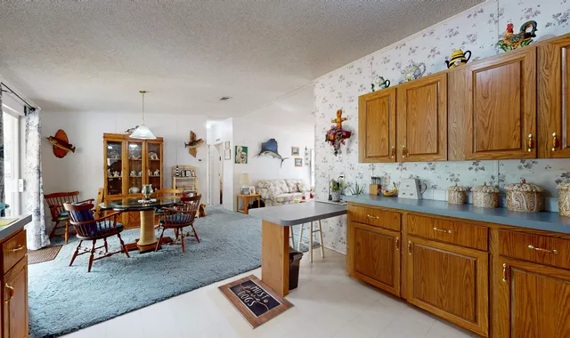 a view of a kitchen and dining room