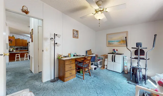 a view of a workspace with furniture and a livingroom
