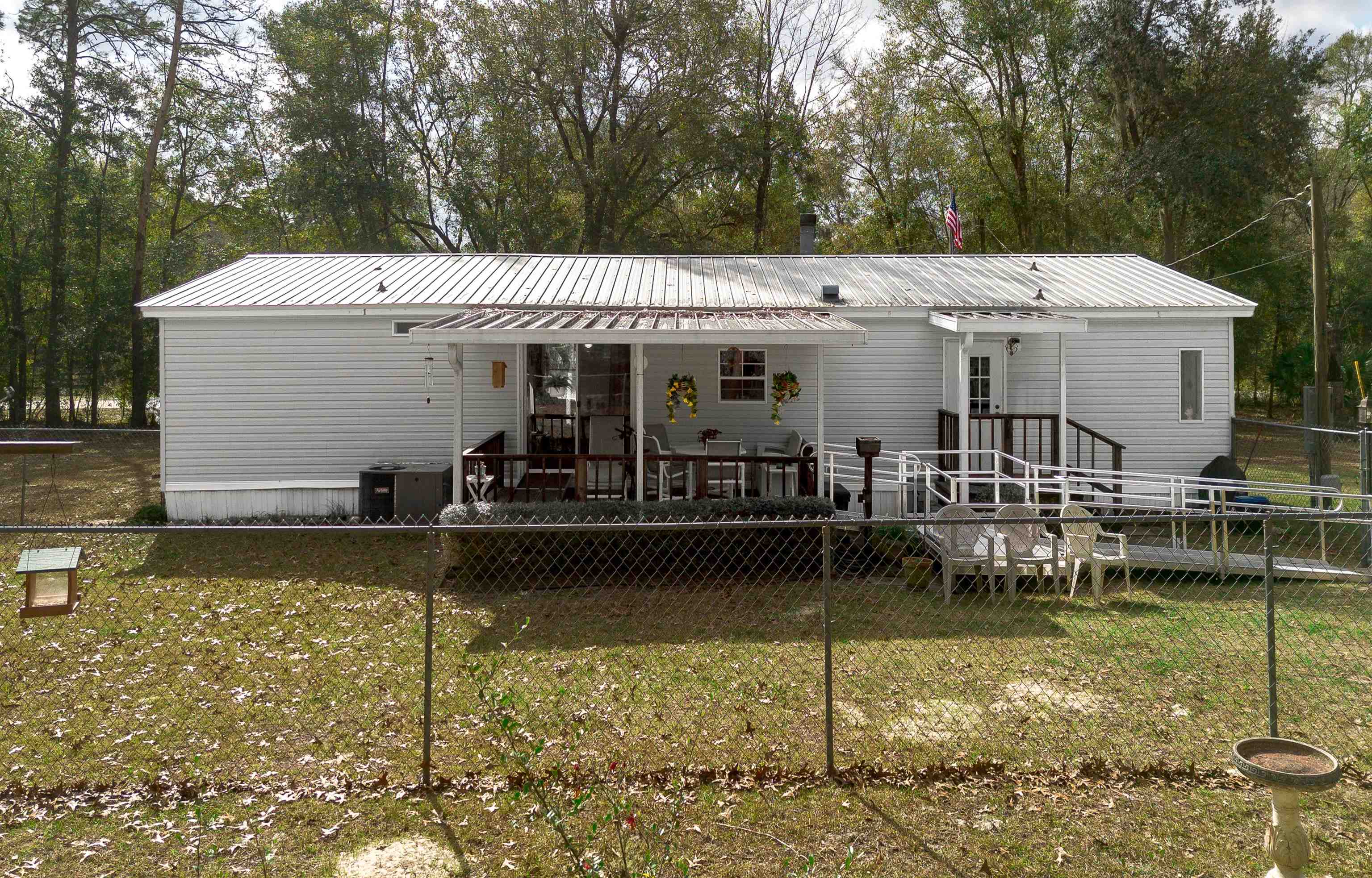 100 Harper Place Satsuma, FL 32189 - Photo 24 of 32 a view of a house with swimming pool next to a yard