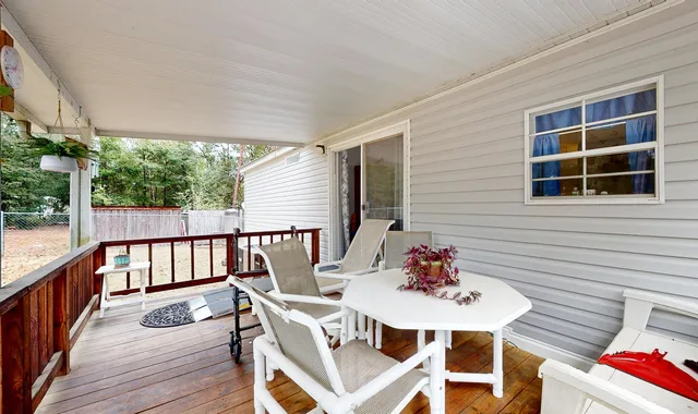 a outdoor dining space with furniture and outdoor view