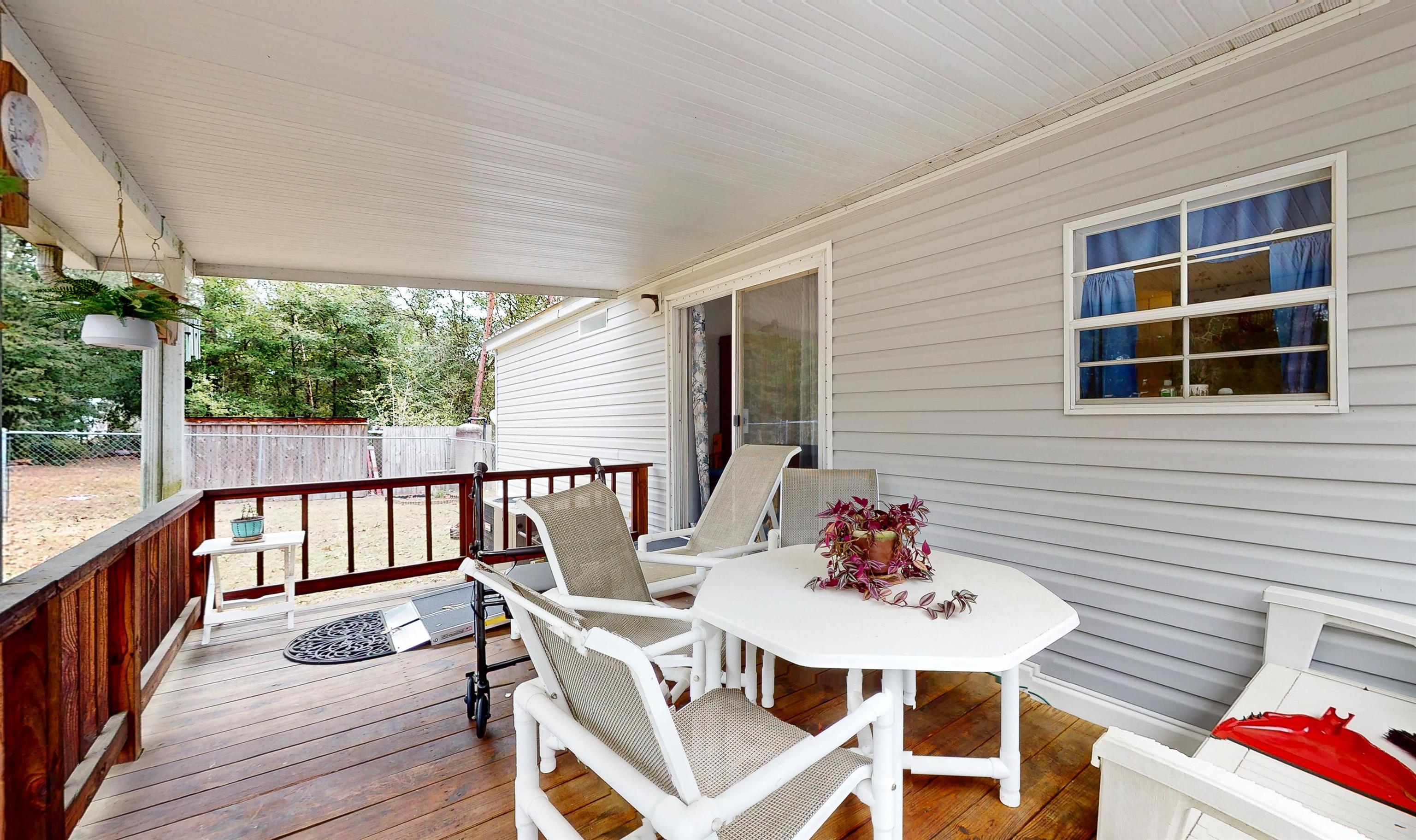 100 Harper Place Satsuma, FL 32189 - Photo 26 of 32 a outdoor dining space with furniture and outdoor view
