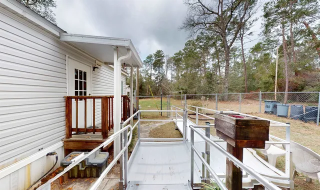 a view of a balcony with chairs