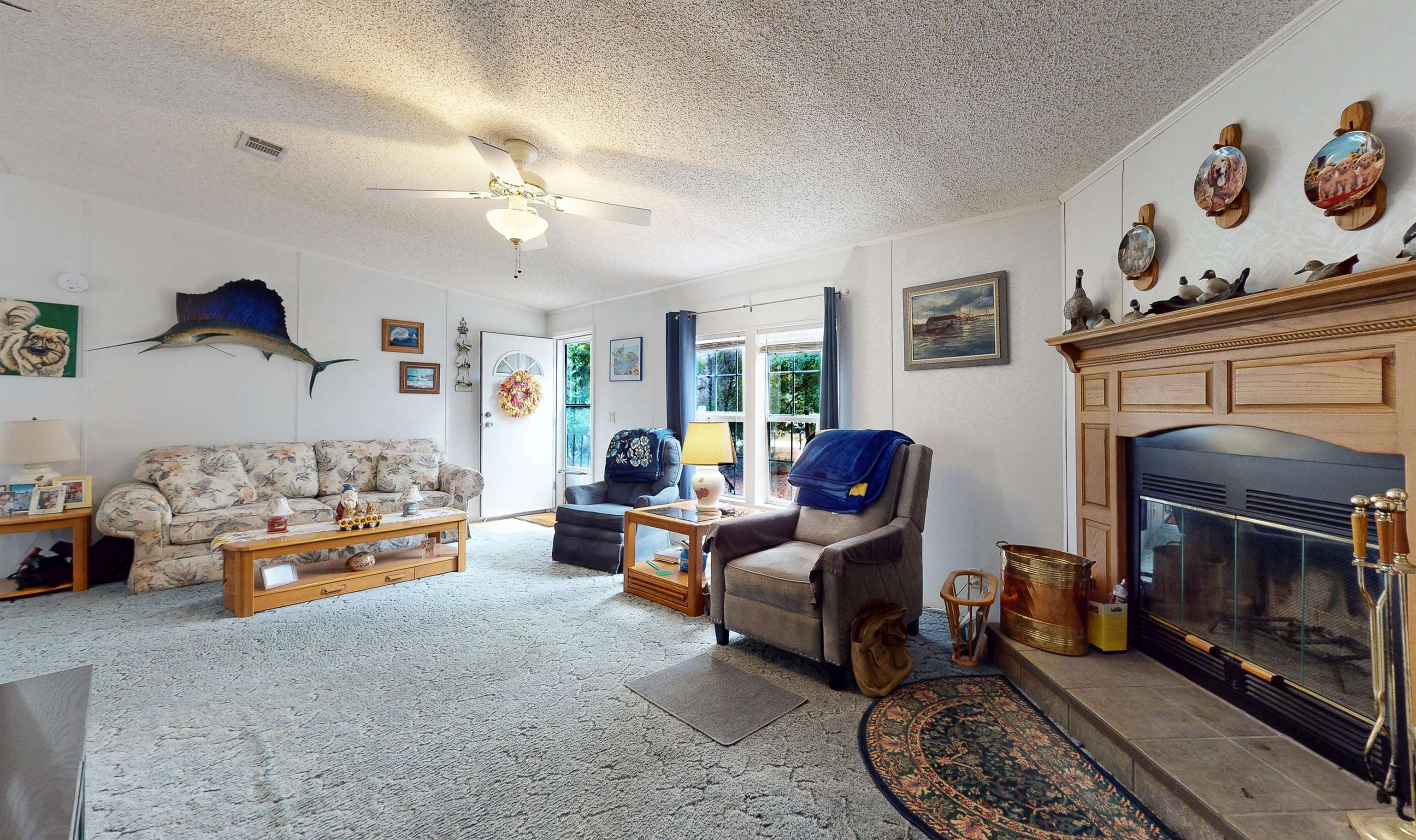 100 Harper Place Satsuma, FL 32189 - Photo 3 of 32 a living room with furniture fireplace and a window