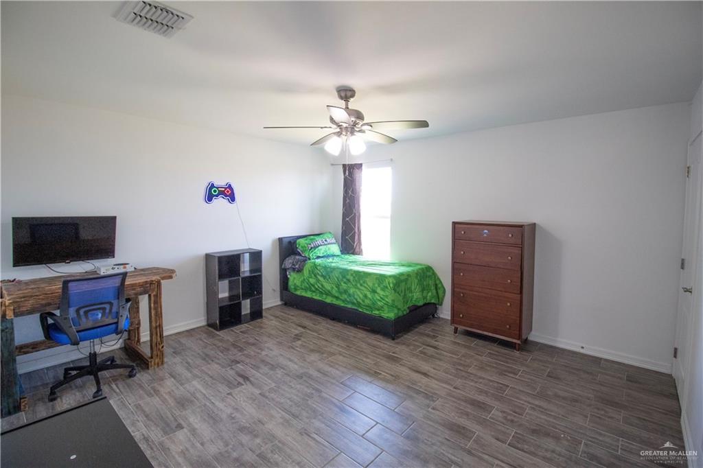 1307 Rio Grande Street San Juan, TX 78589 - Photo 14 of 23 a living room with furniture and a flat screen tv